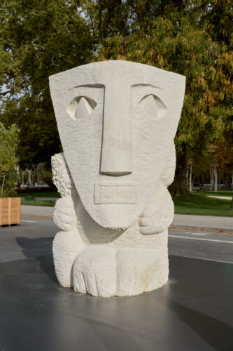 Stefan Rinck, 2025, Camarilla in Disguise, Limestone, 295 x 170 x 200 cm. Instalaltion at Art Basel Paris 2025, Grand Palais. © Graysc. Courtesy Semiose, Paris and the artist.