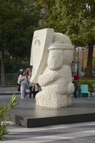 Stefan Rinck, 2025, Camarilla in Disguise, Limestone, 295 x 170 x 200 cm. Instalaltion at Art Basel Paris 2025, Grand Palais. © Graysc. Courtesy Semiose, Paris and the artist.